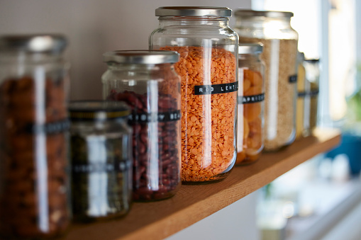 Close Up Of  Glass Jars On Shelf Being Reused To Store Dried Food Living Sustainable Lifestyle At Home