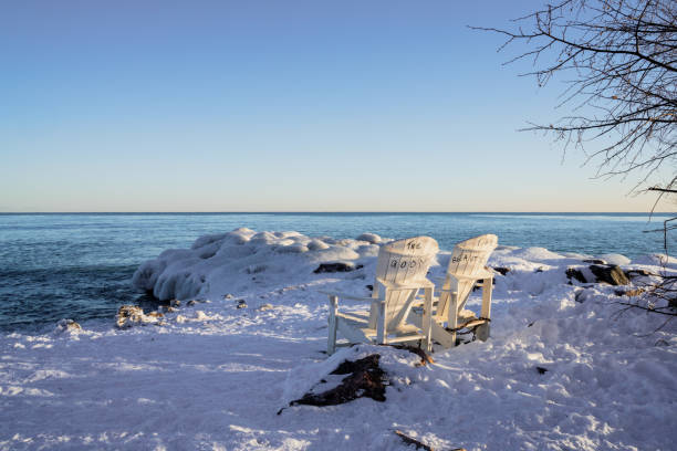istock Adirondack chairs on ontario lake in winter, Canada. 1370745076
