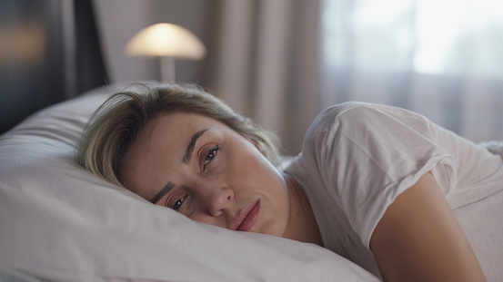 Beautiful woman sleeping peacefully in her bed.