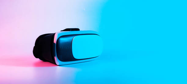 istock Virtual reality headset VR. 3d digital glasses on futuristic neon tech background. VR future gadgets technology, education online, studying, video game concept. 1370747164