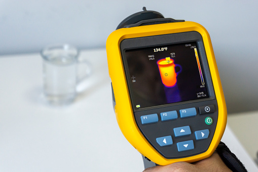 Infrared thermal camera displays glass with hot liquid inside