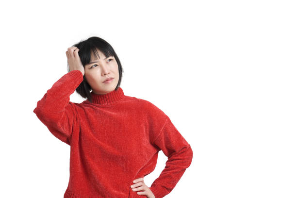 istock Young asian woman with pensive expression, thoughtful face, isolated. 1370748328