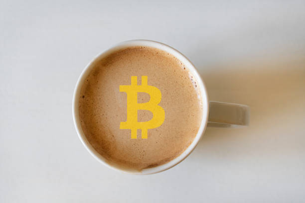istock Cup of coffee with bitcoin symbol 1370749946