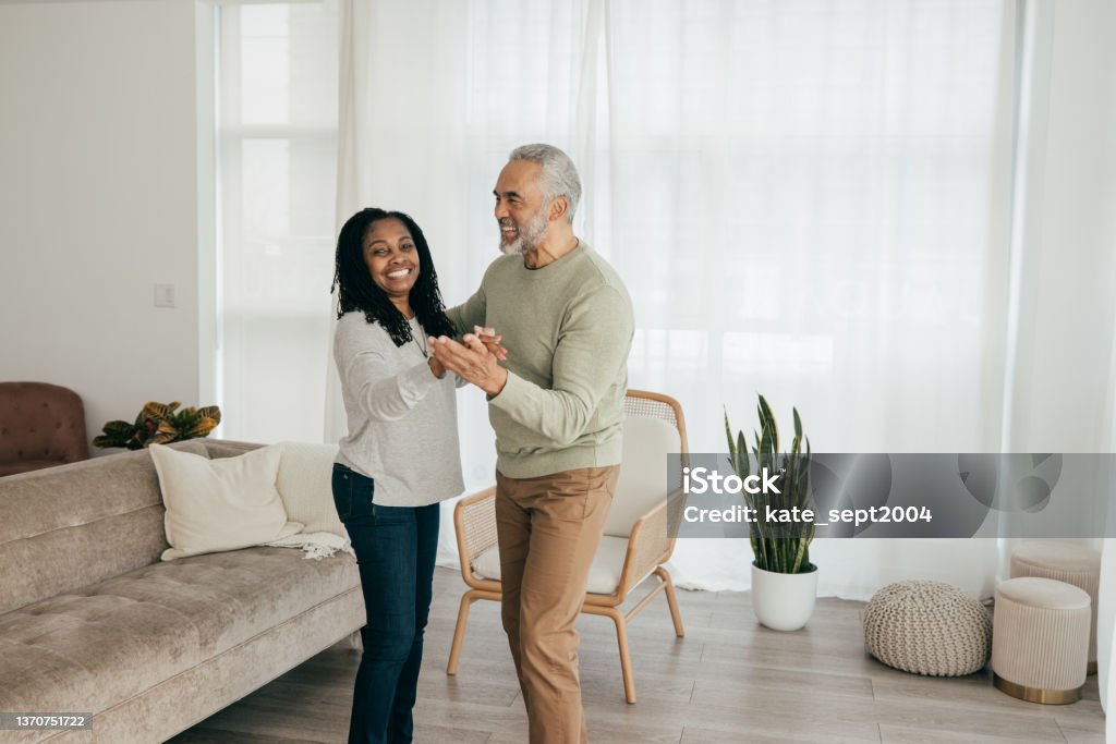 Earning income while retired The healing power of gratitude - senior couple learning how to dance Black People Stock Photo