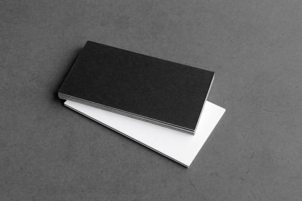 istock Business card on black background. 1370753370