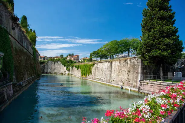Peschiera del Garda is a town and comune in the province of Verona, Veneto, Italy. Parts of the old town with their fortifications separate the place from the mainland