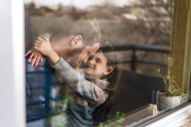 istock Smiling loving adorable little daughter hugging her father 1370753830
