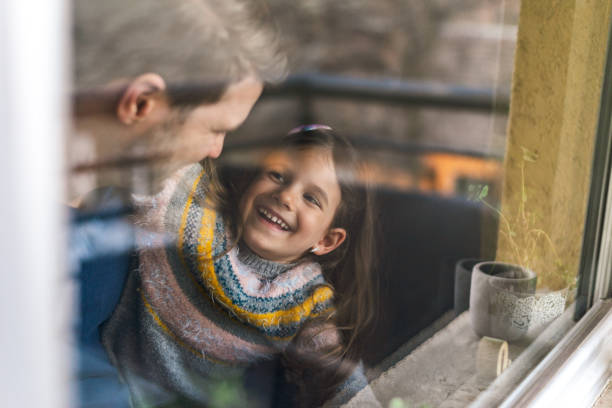 istock Smiling loving adorable little daughter hugging her father 1370753986