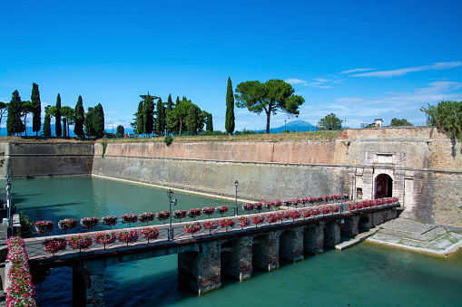 Peschiera del Garda is a town and comune in the province of Verona, Veneto, Italy. Parts of the old town with their fortifications separate the place from the mainland