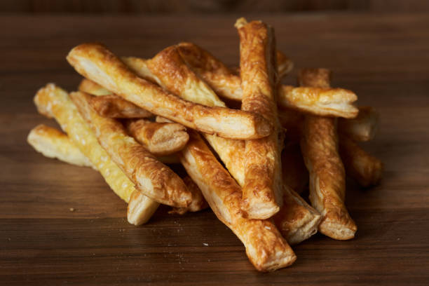 istock Cheese crackers on wooden board 1370757506