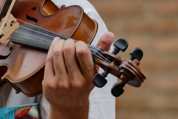 istock Person playing music outdoors 1370758101
