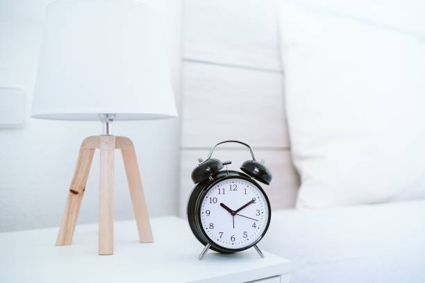 istock alarm clock at 10 am on bedroom during morning, wake up concept 1370759940