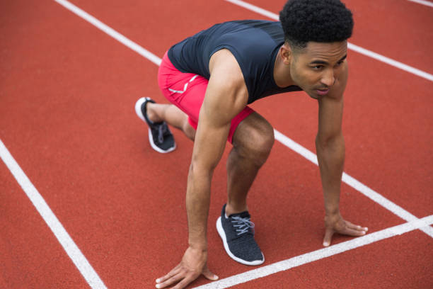 istock Handsome concentrated african athlete man ready to start 1370760193