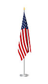 istock Flag of the United States of America on steel flagpole. Usa Flag isolated on white background. 1370760650