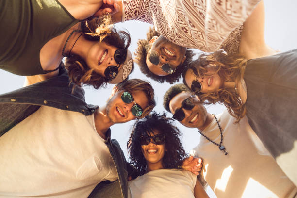 istock Multiethnic group of friends huddle join in a circle 1370761631