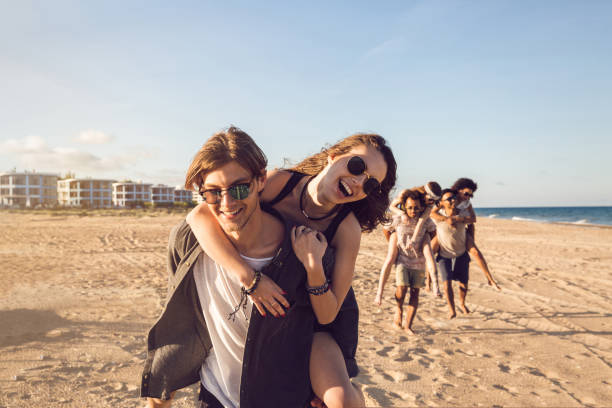 istock Three young men giving their girlfriends piggyback rides 1370763054