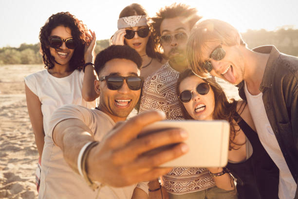 istock Multiracial group of friends taking selfie 1370763188