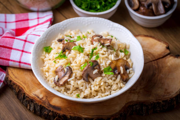 istock Mussel rice pilaf. Rice with mussels on small white plate on ceramic. 1370763306
