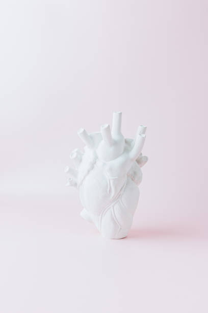 istock Sculpture Heart on a pink background. Creative Love, Valentine's day concept. 1370763408