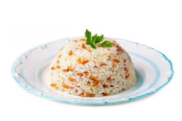 Turkish traditional food; Rice pilaf with barley noodles on a white background (Turkish name; Arpa sehriyeli pirinc pilavi) Turkish traditional food; Rice pilaf with barley noodles on a white background (Turkish name; Arpa sehriyeli pirinc pilavi) ARPA stock pictures, royalty-free photos & images