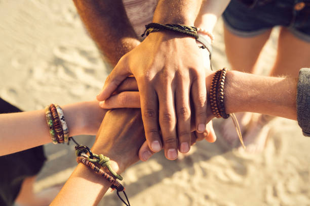 istock Close up of hands holding together 1370764250