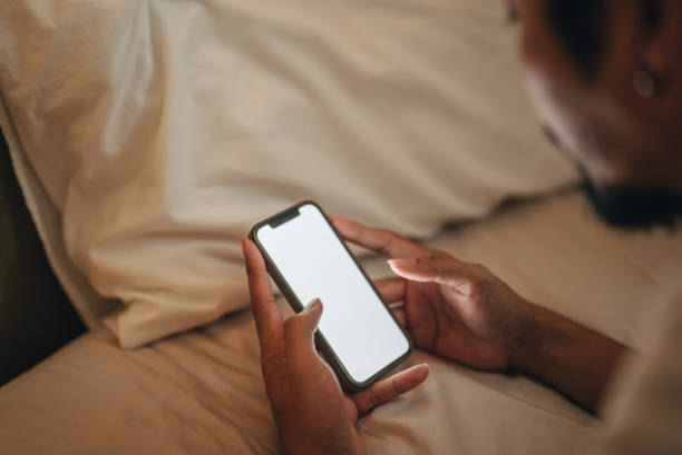 istock Hands of mature man using mobile phones at weekend 1370764898