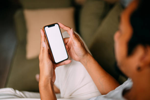 istock Hands of mature man using mobile phones at weekend 1370764910