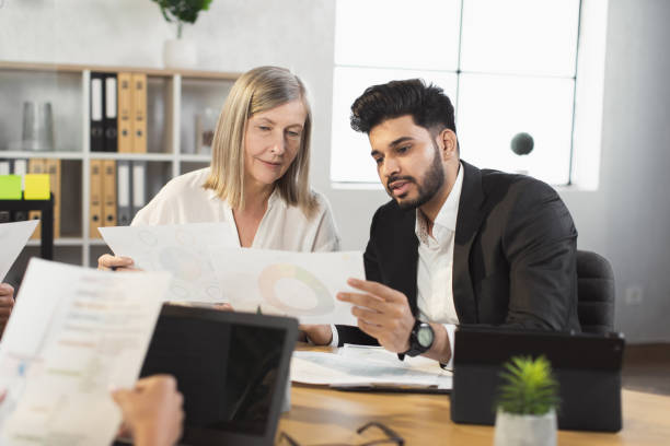 istock Diverse business people discussing common project on meeting 1370765512