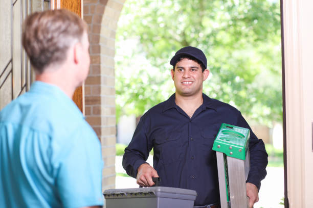 istock Latin descent repairman, technician makes house call at customer home. 1370765799