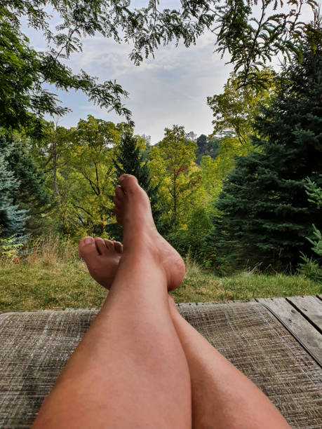 istock Female's bare feet in tree area 1370768495