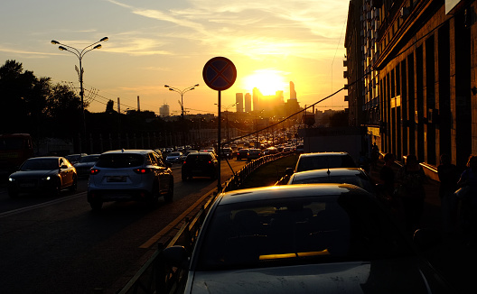 Automobile traffic on the Garden Ring in Moscow at sunset.