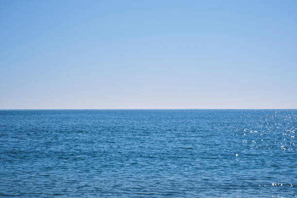 istock blue sea and blue sky background 1370770653