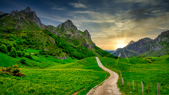 Track and mountains in Valle del Lago, Somiedo Nature Park, Asturias, Spain