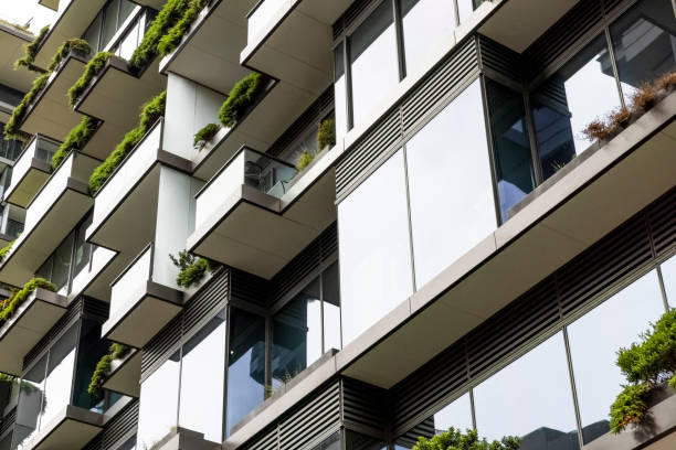 istock Closeup low angle view of modern apartment building, background with copy space 1370773746