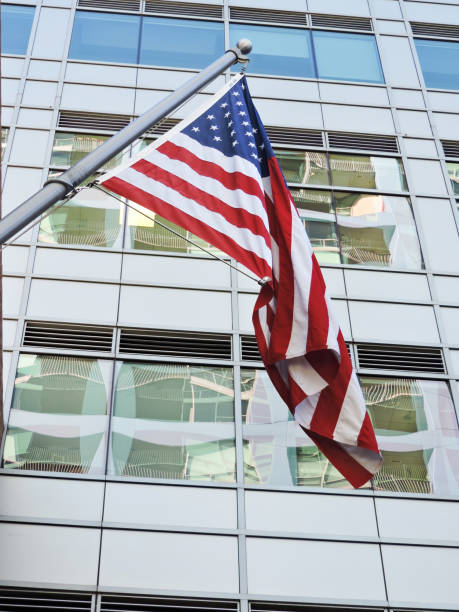 istock American Flag Against Office Building 1370774973