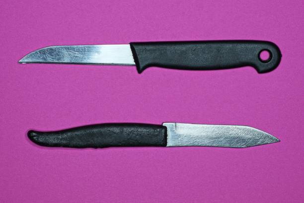 istock two small knifes with a black plastic handles and a white metal blades 1370777575