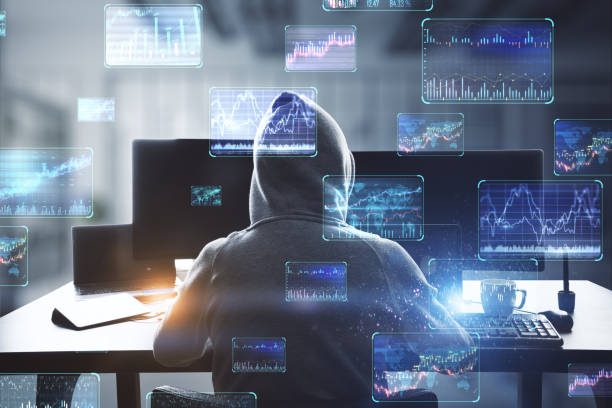 Back view of hacker at desktop using computers with various forex screens on blurry office interior background. Cryptocurrency, hacking, bticoin trading and finance concept. Double exposure. stock photo