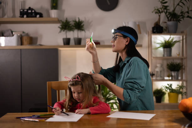 istock Mom searching for lice 1370785566
