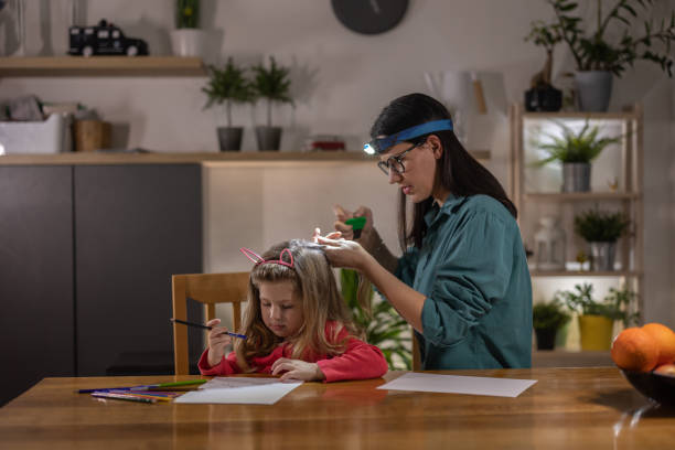 istock Mother searching for lice 1370785615