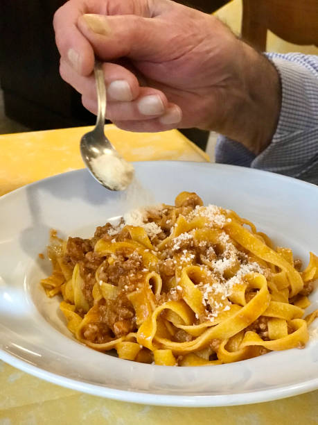 istock Getting ready to eat “ tagliatelle “ with meat sauce and grated parmesan cheese 1370786843