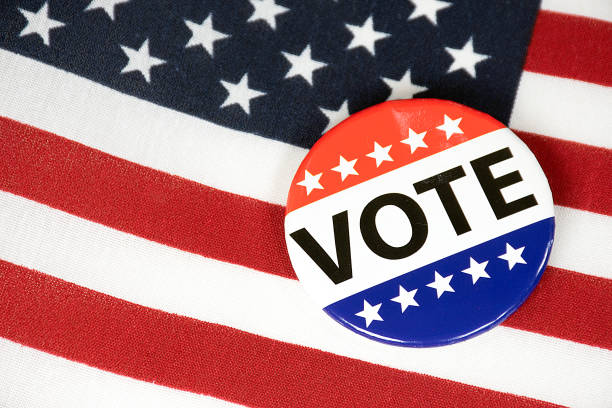 istock Campaign Vote Pin On American Flag 1370788651