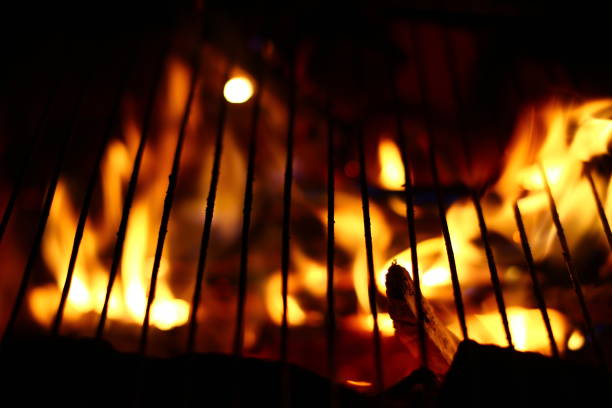 istock Macro of a barbecue grill on fire 1370793432