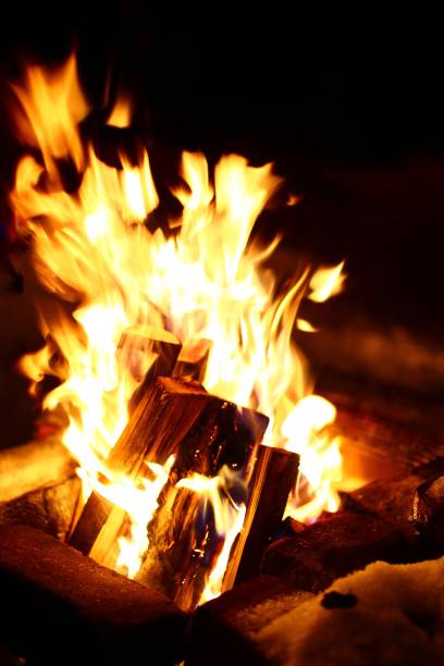 Big fire in a masoned fireplace in winter.