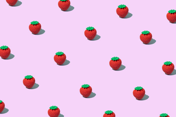 istock Trendy sunlight summer pattern made with strawberry on light pink background. Minimal summer food concept. 1370796896