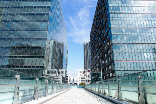 Sky and clouds reflected in a modern building glass facade