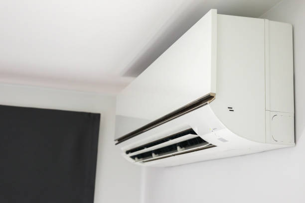 istock Air conditioner on white wall room interior background 1370800232