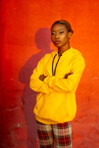 istock Woman looking at camera with arms crossed 1370800427