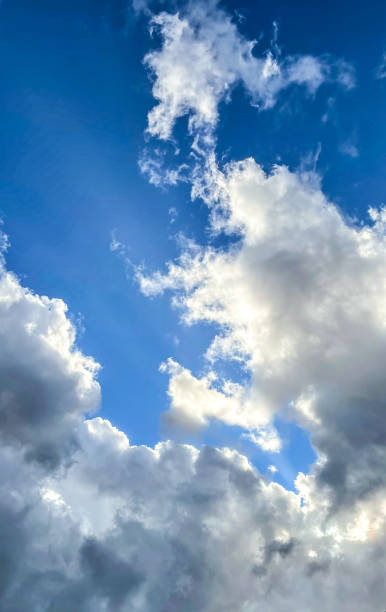 istock Streams of sunlight in a cloud filled sky 1370800780
