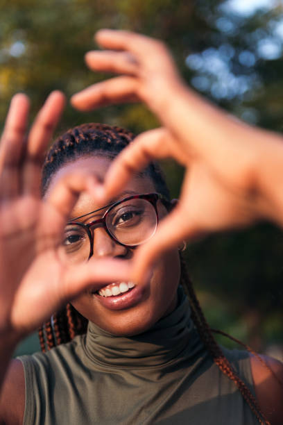 istock young black woman making a heart with her hands 1370800900