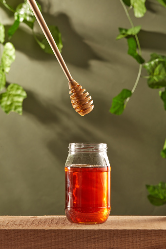 Dripping Honey to Jar